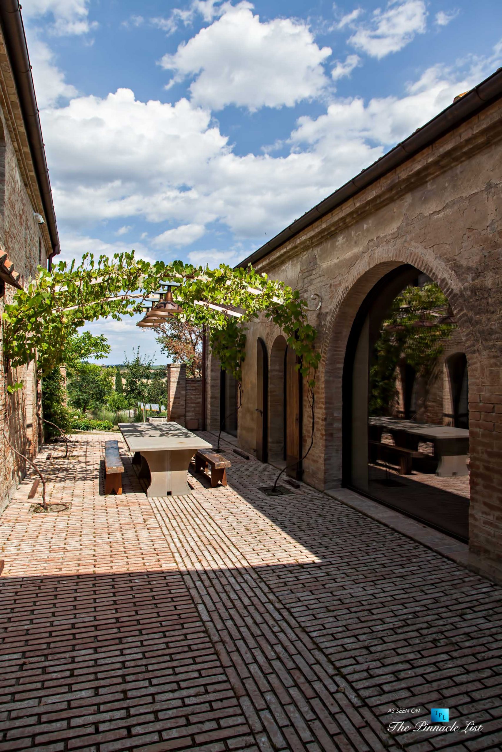 Podere Paníco Estate – Monteroni d’Arbia, Tuscany, Italy – Exterior Sitting Area Table – Luxury Real Estate – Tuscan Villa