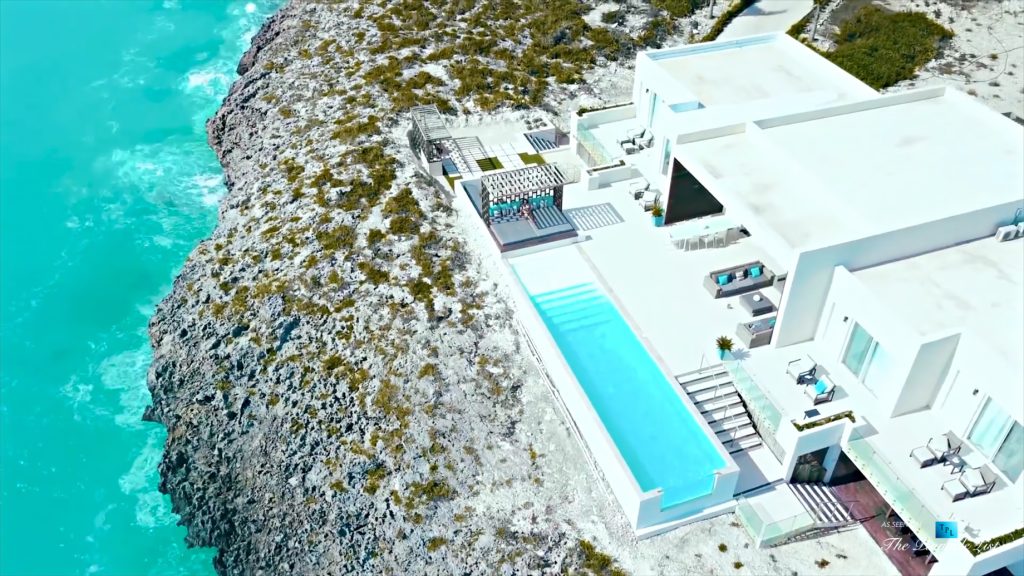Tip of the Tail Villa - Providenciales, Turks and Caicos Islands - Drone Aerial Caribbean House Infinity Pool Deck - Luxury Real Estate - South Shore Peninsula Home