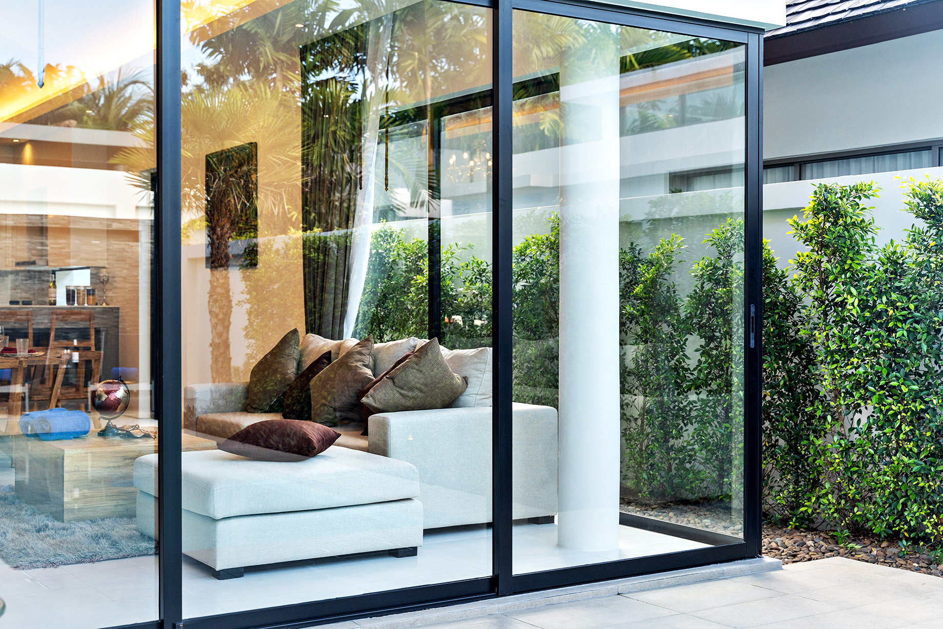 Open Plan Living Area with Glass Sliding Door and Garden