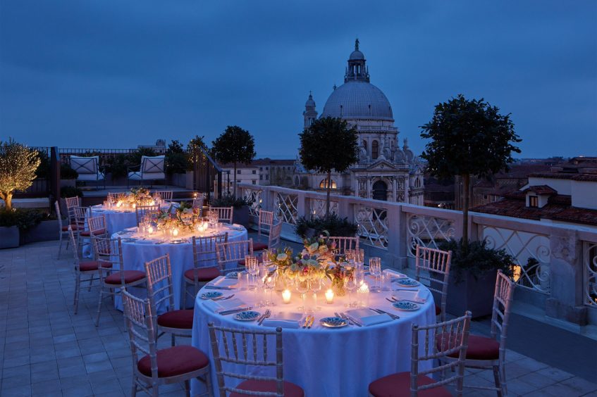 The St. Regis Venice Luxury Hotel - Venice, Italy - The Santa Maria Suite Terrace Outdoor Social Setting at Night