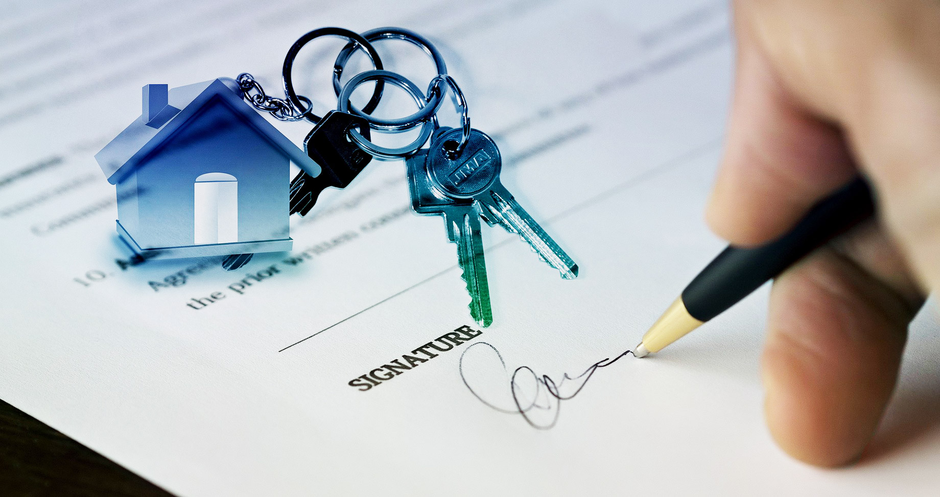 Real Estate Agent Signing A Contract