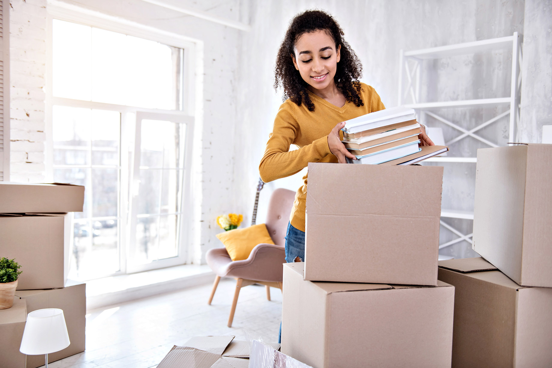 Female Student Moving To Off-Campus Housing