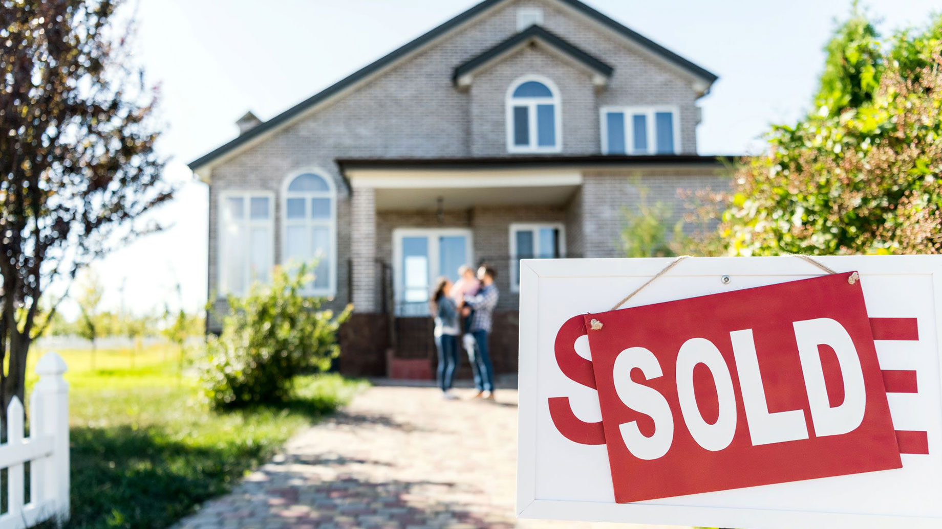 Family Outside House Sold