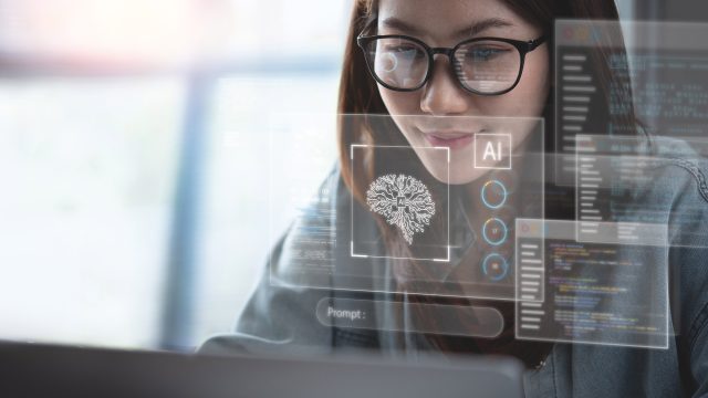 Woman Using AI on a Computer