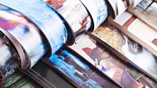 Stack of Open Colourful Magazines
