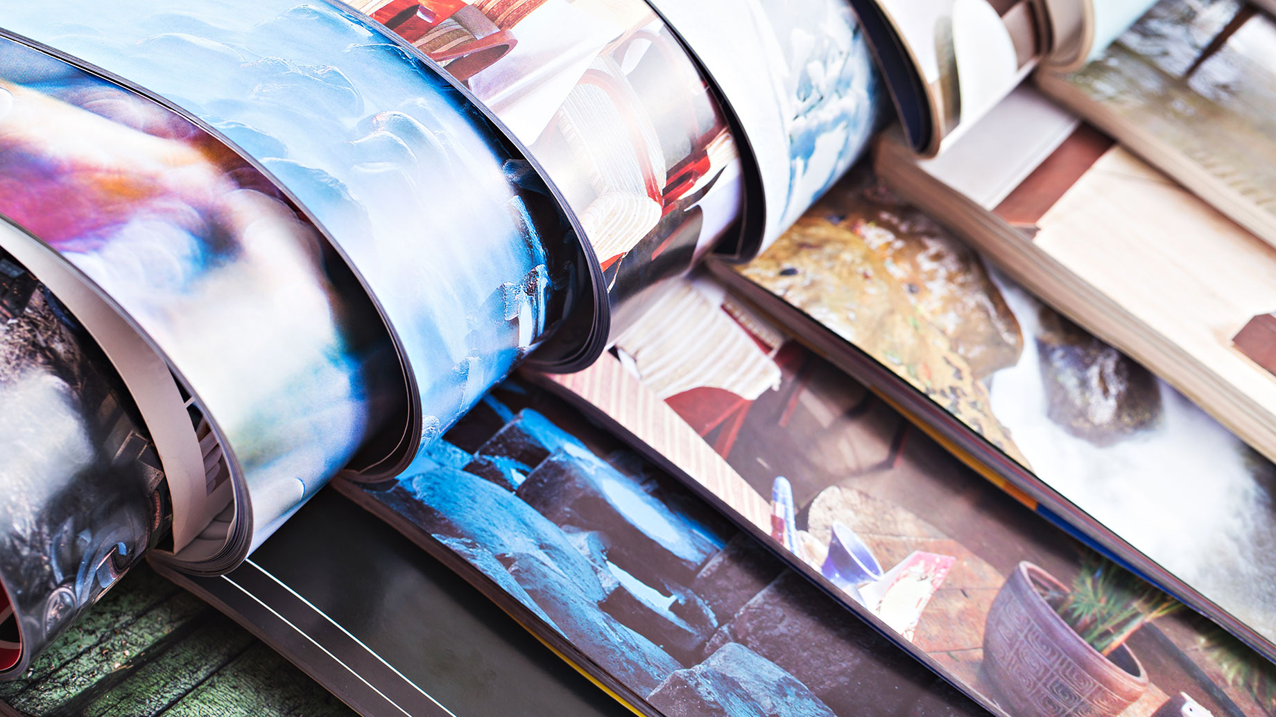 Stack of Open Colourful Magazines