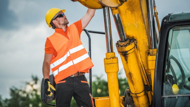 Excavator and Construction Man