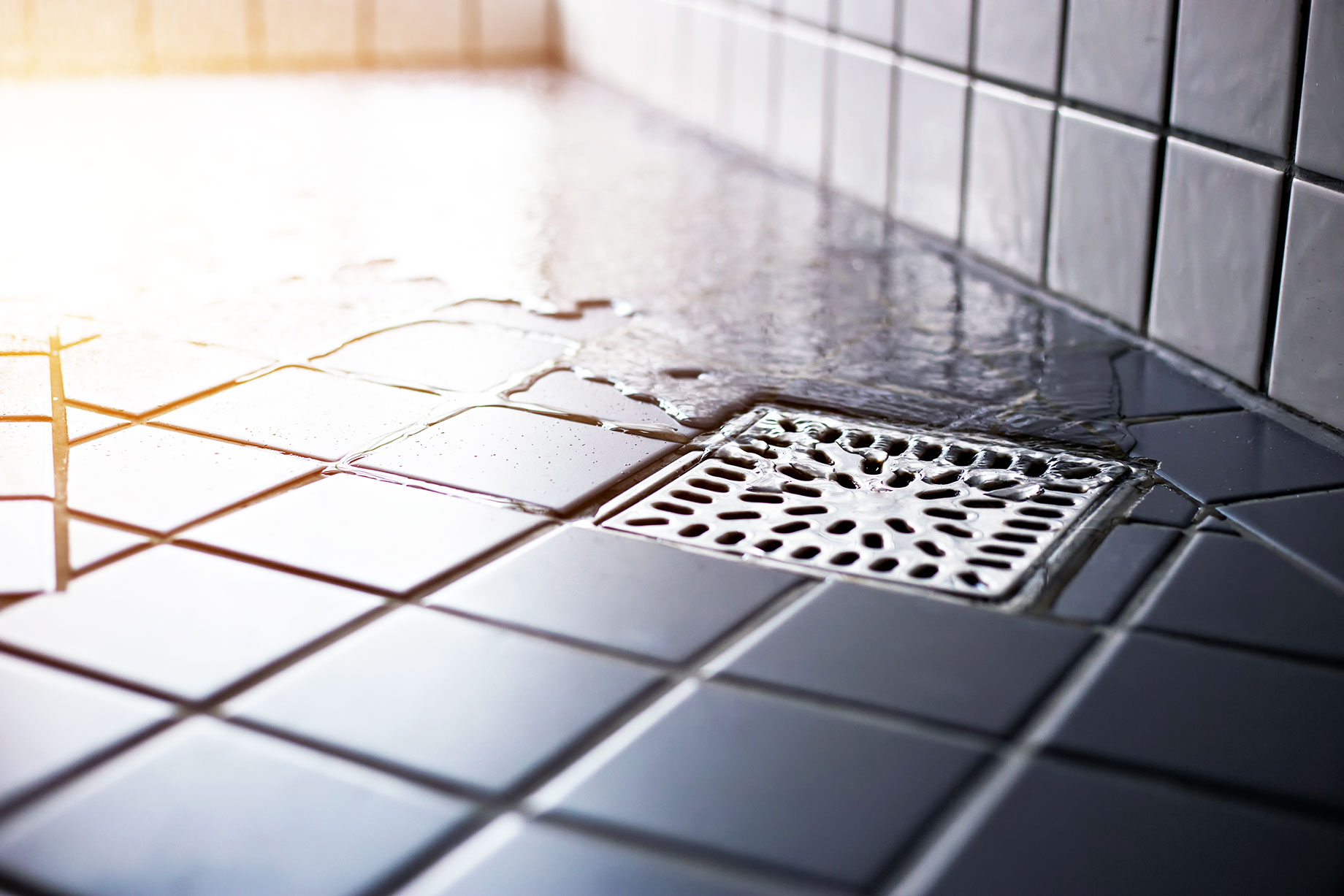 Water Flowing to Square Shower Drain