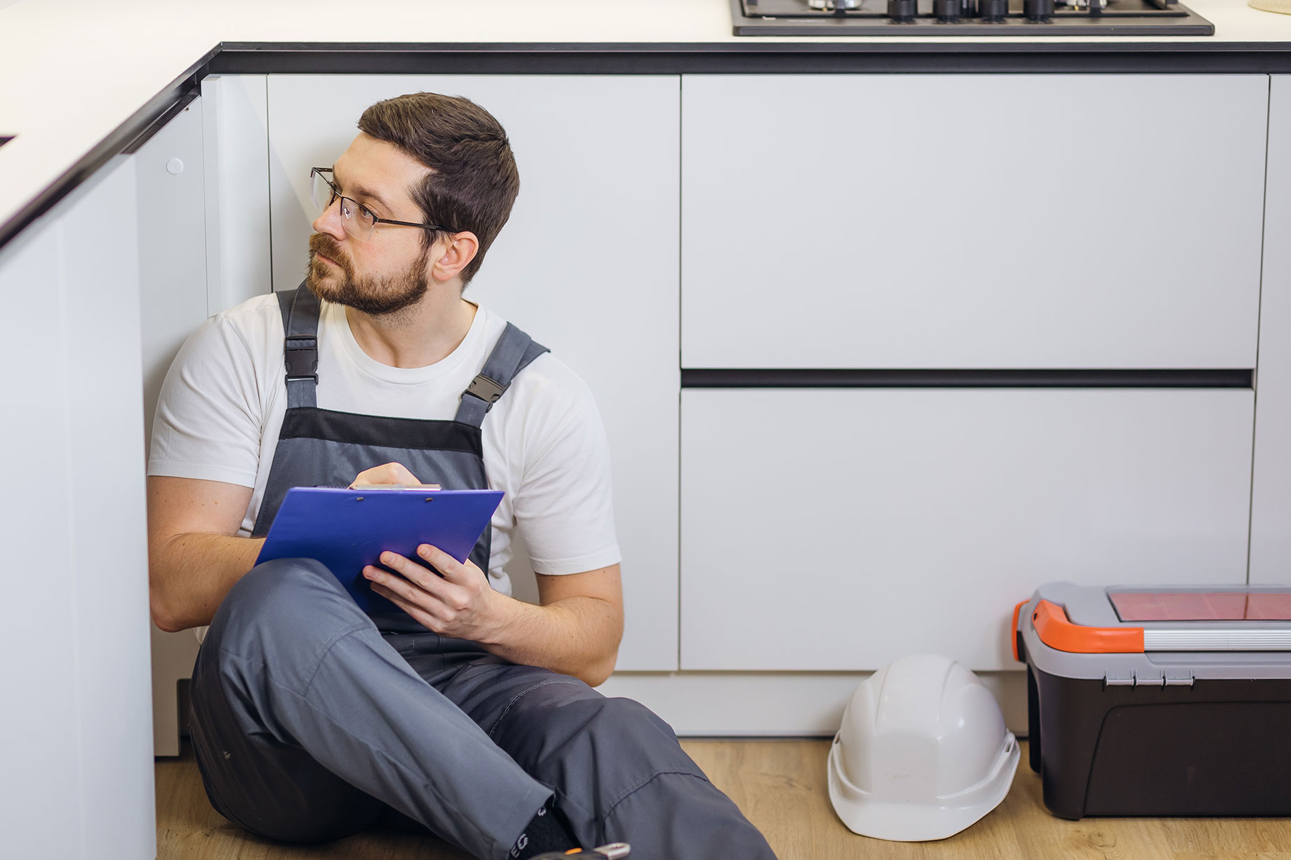Tradesman Evaluating a Kitchen