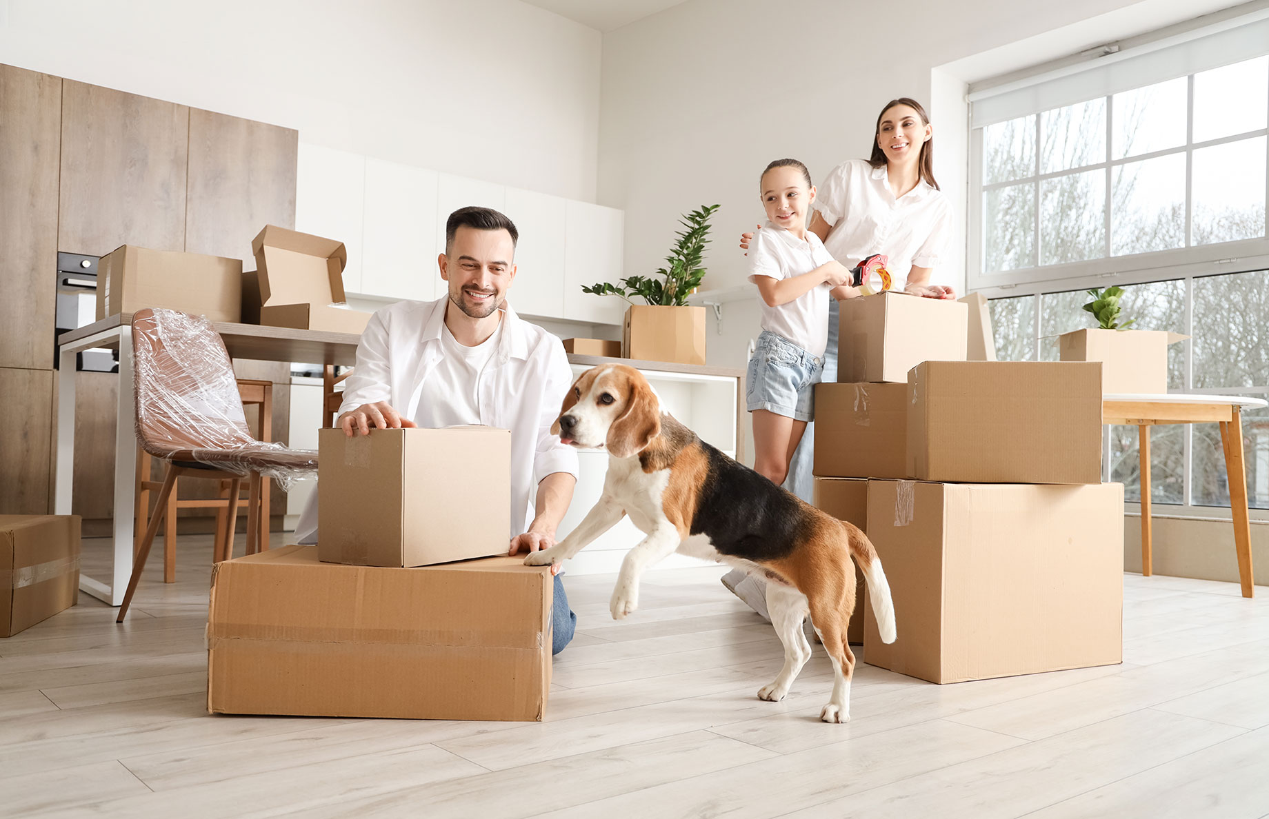 Young Family Moving with Dog