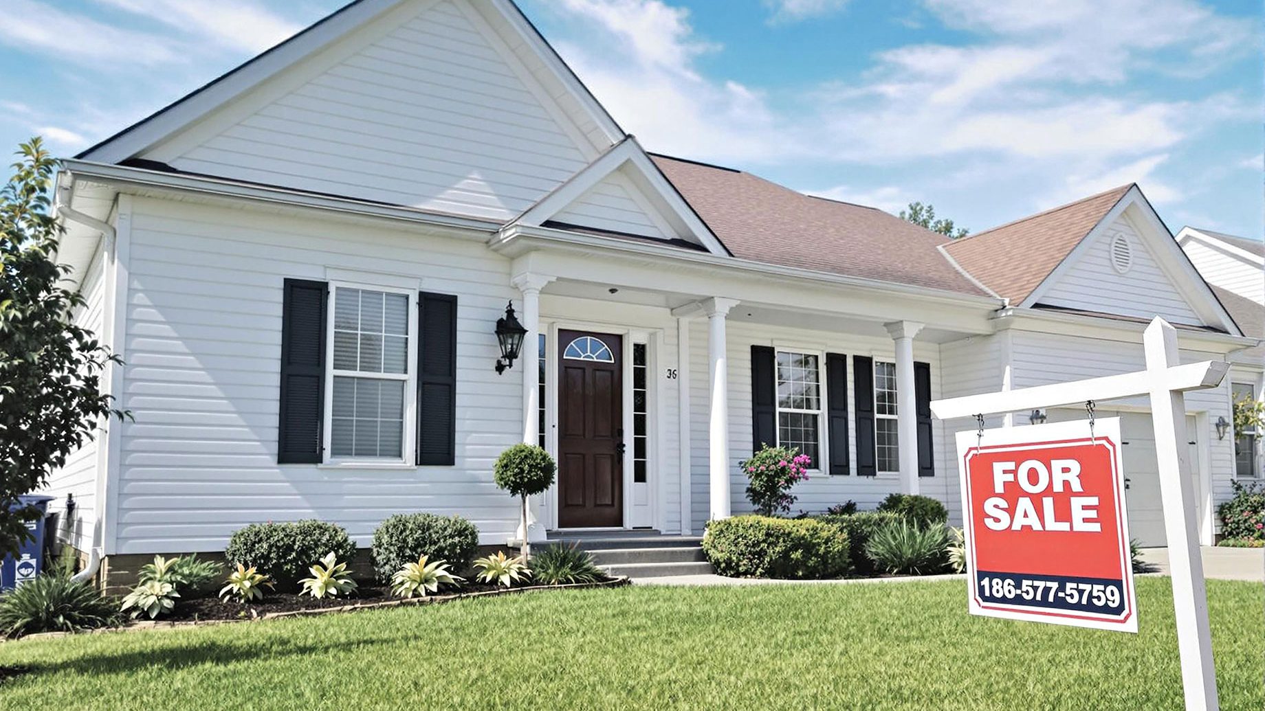 A welcoming suburban home in Charlotte with a 'For Sale' sign in the front yard, well-maintained lawn, and clear blue sky.