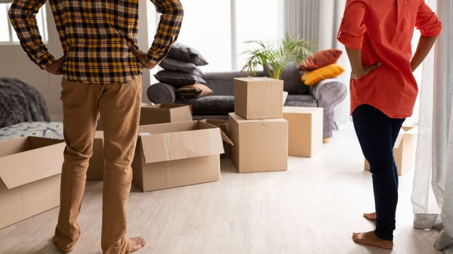 Couple Contemplating Packing and Moving Their Belongings