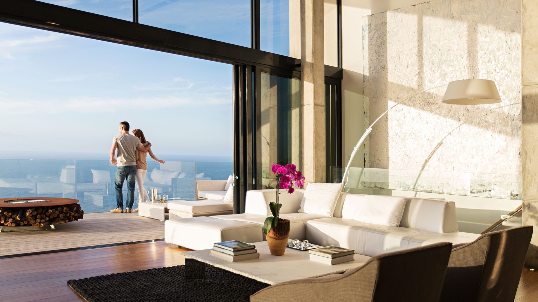 Couple on Balcony of Modern Ocean View Luxury Home
