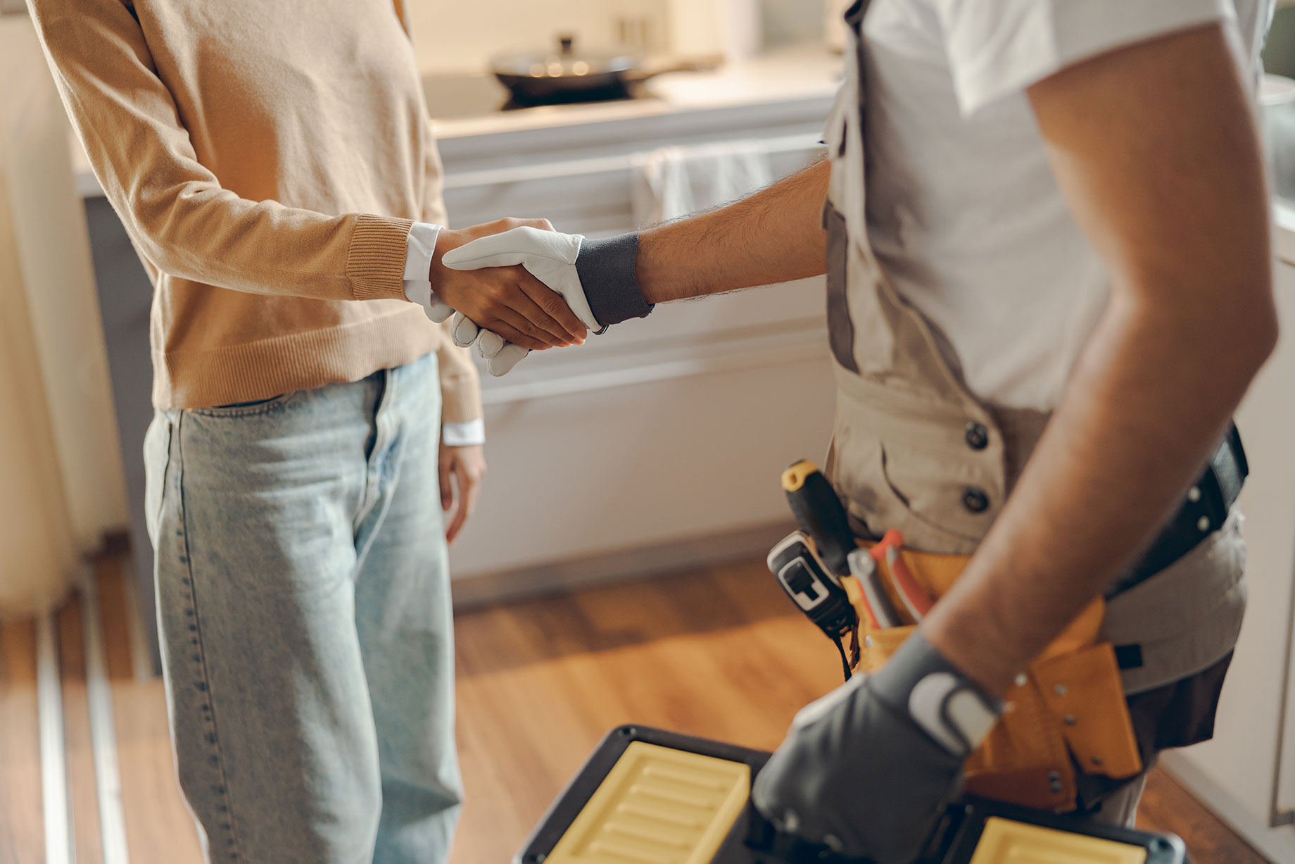 Handyman Shaking Hands with Homeowner