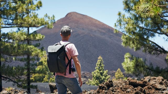 Hiker in front of the Chinyero Volcano - Tenerife, Canary Islands, Spain