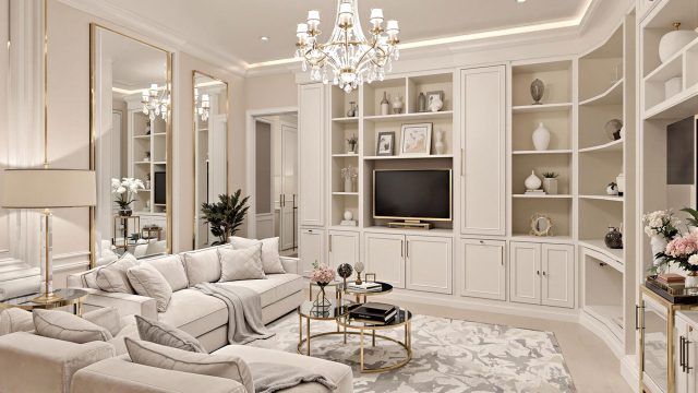 A beautifully remodeled small living room featuring elegant lighting, plush textiles, and sophisticated decor, with mirrors and light colors creating an illusion of a larger space.