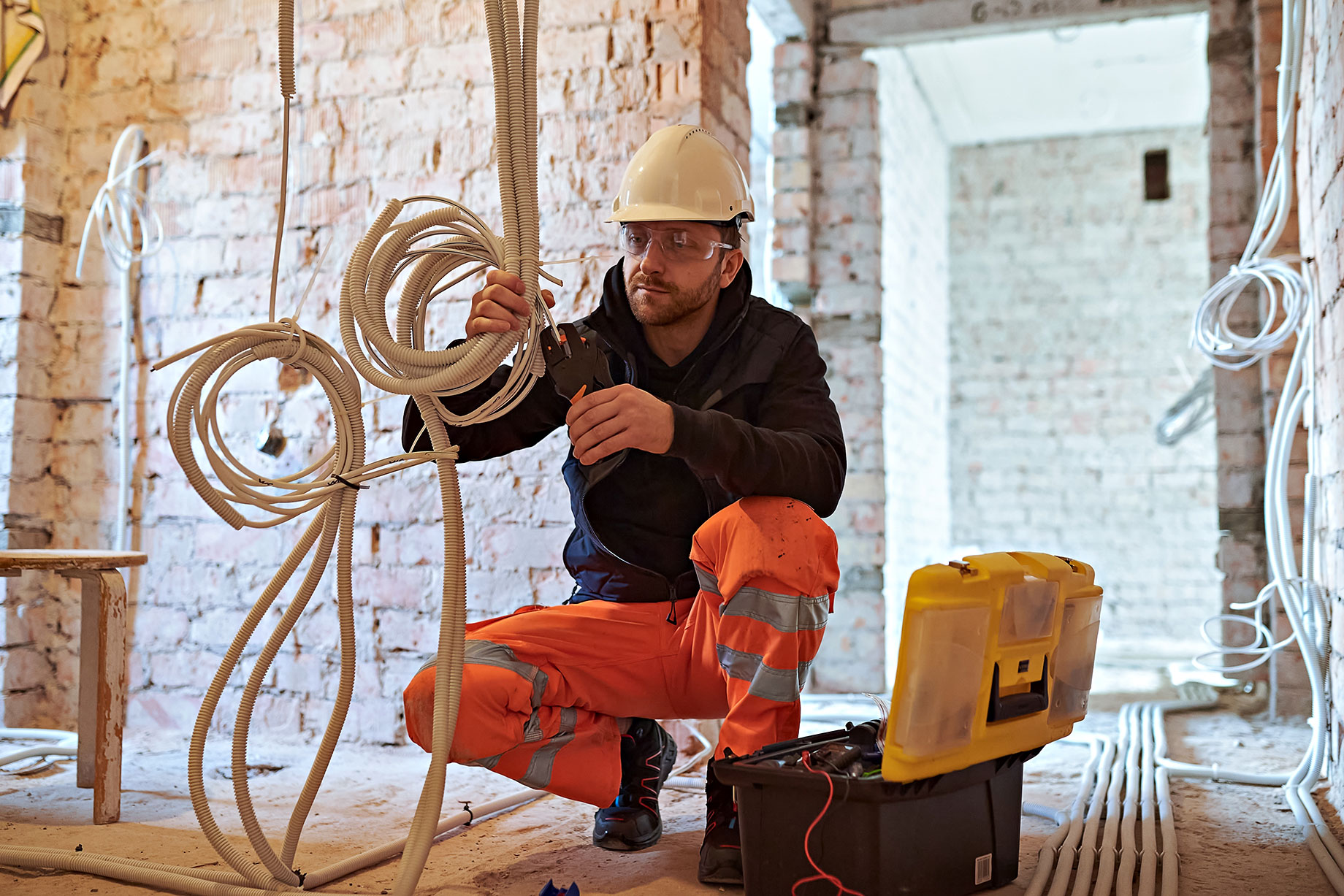 Electrician Working on Cables
