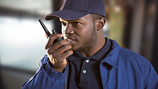 Man Using a Walkie-Talkie