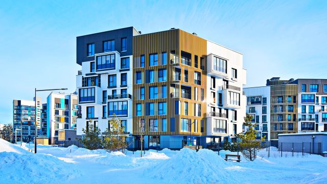 Modern Block of Apartment Flats in the Winter with Snow