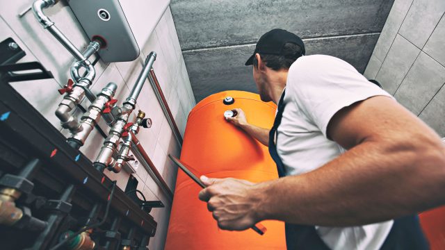Technician Working on a Heating Boiler