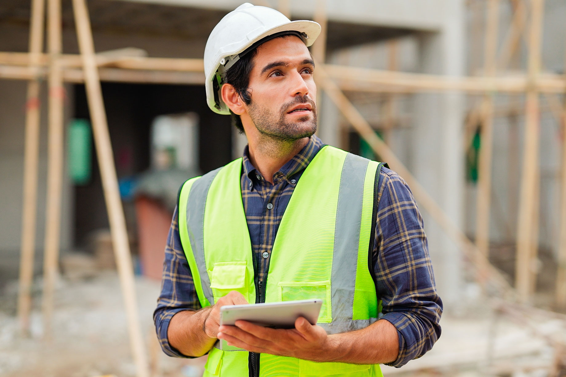 Civil Engineer Inspecting Home Under Construction