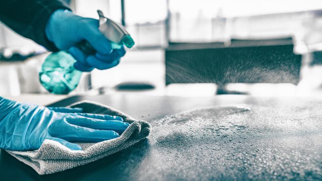 Cleaning Home with Sanitizing Spray