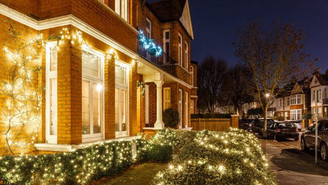 House Decorated with Christmas Lights in London, England, UK