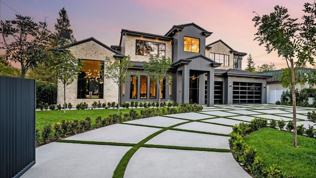 Modern Luxury Home Exterior with a Well-Manicured Lawn