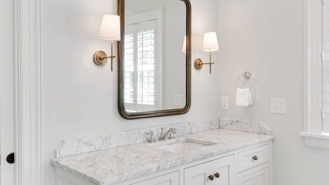 Modern White Bathroom Interior with Marble Sink and Mirror