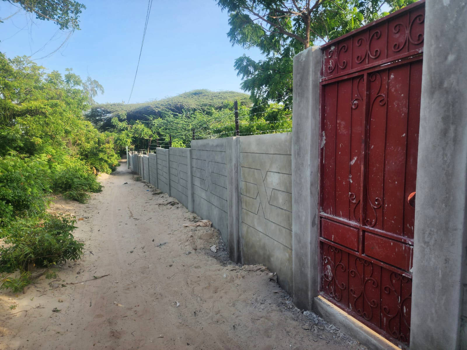 New Fenced Wall with a Gateway Door – Beachfront Land Estate Site – Shela, Lamu Island, Kenya
