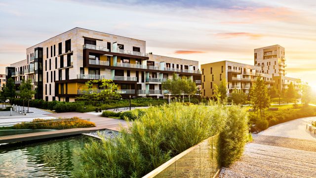 Residential Apartments in a Public Green Park during Sunrise