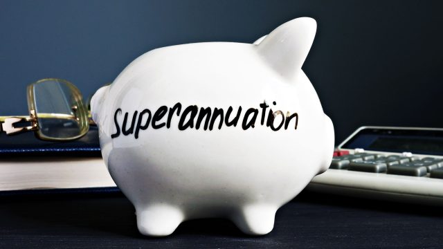 Superannuation Written on a White Piggy Bank