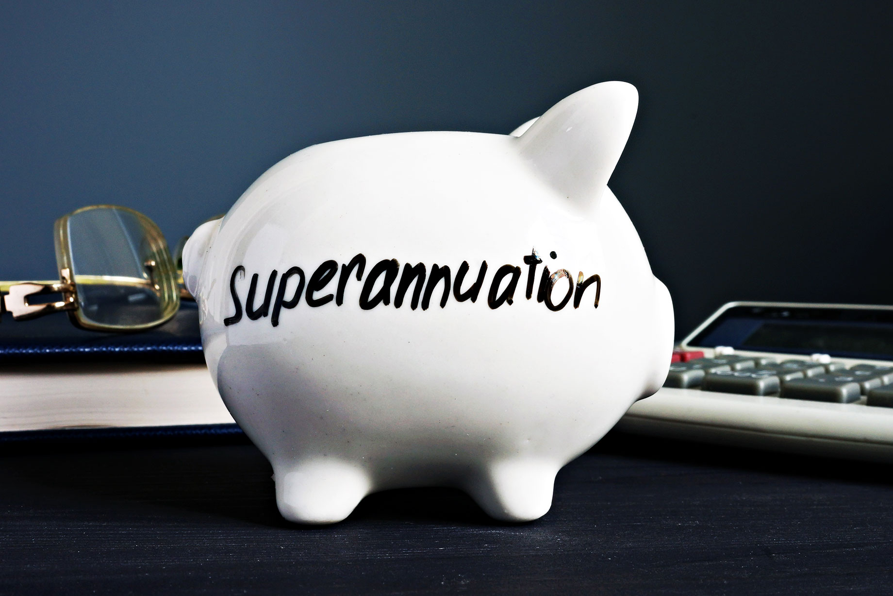 Superannuation Written on a White Piggy Bank