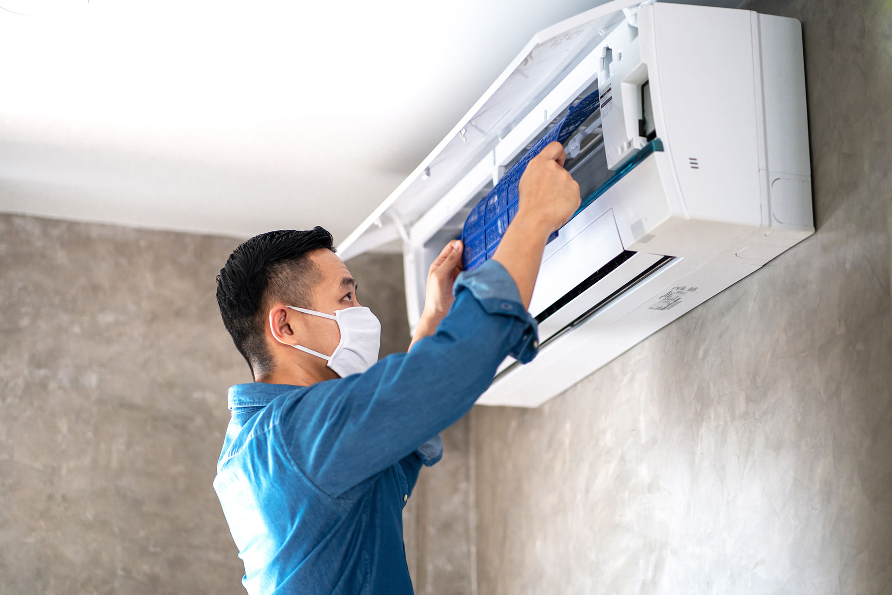 Technician Repairing AC Unit
