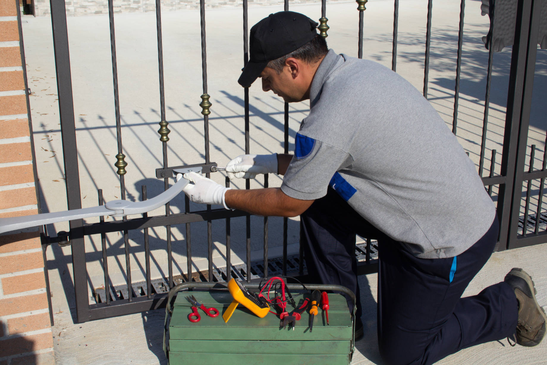 Technician Repairing Automatic Home Gate