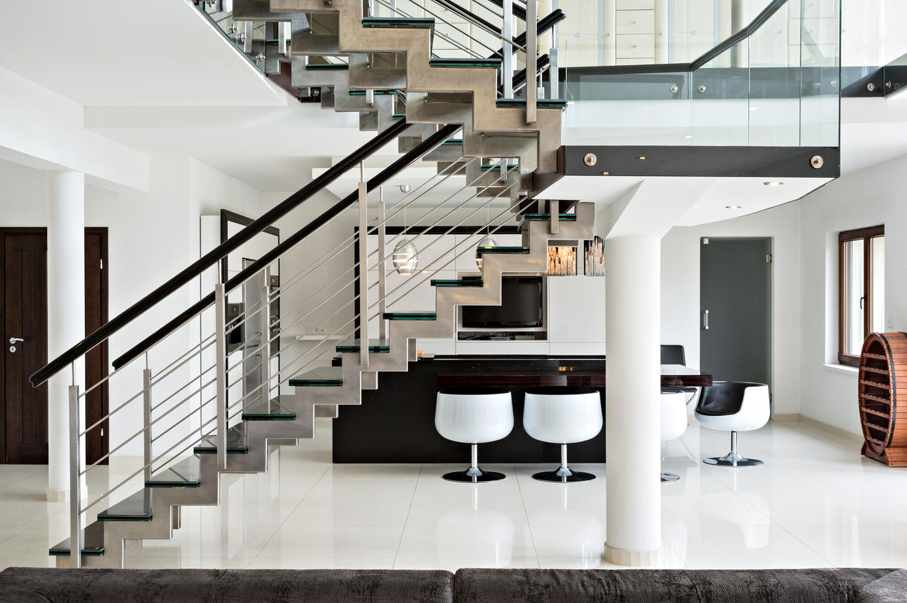 Two-Level Luxury Apartment with Stairs Made of Glass and Steel