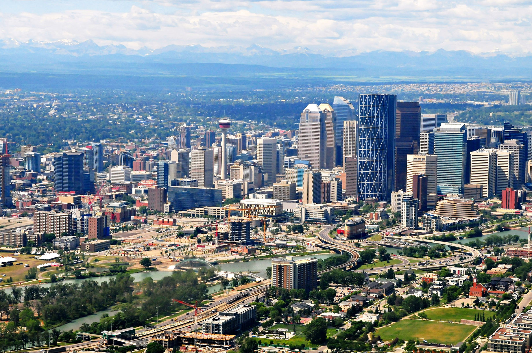 Aerial View of Downtown Calgary, Alberta, Canada with the Rocky Mountains in the Background