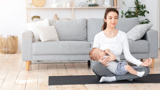 Breastfeeding Child at Home in an Upright Yoga Position