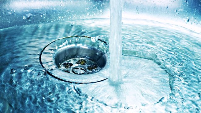 Drain in Sink with Flowing Water