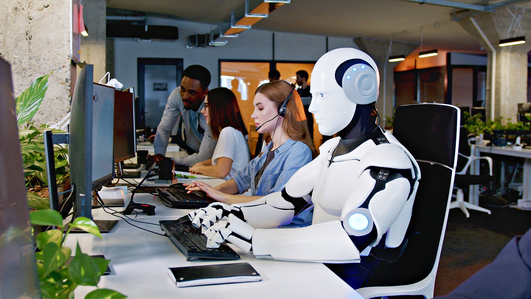 Robot with AI Working at Computer Among People