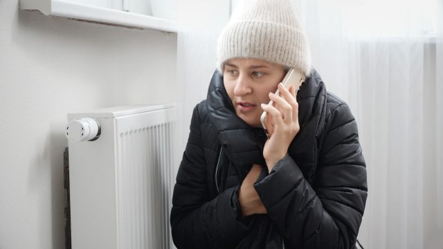Woman Calling for Emergency Heating Service
