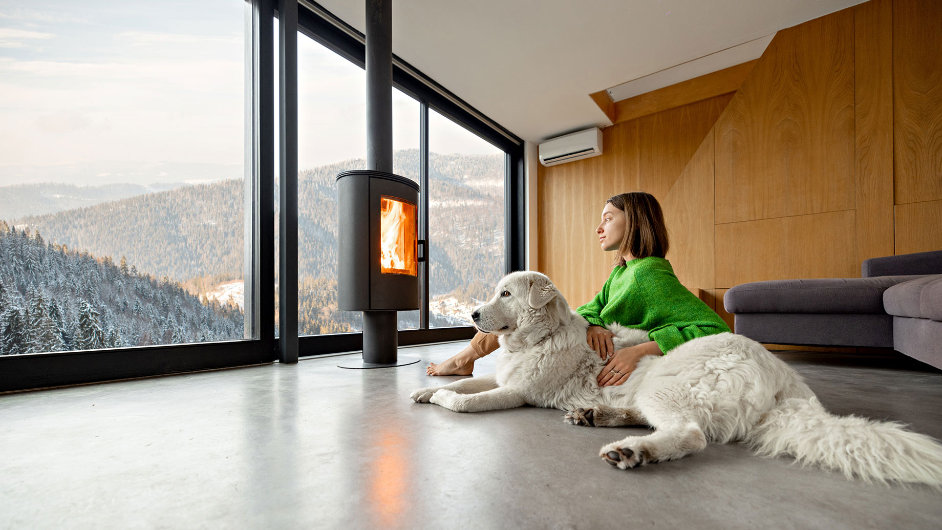 Woman and Her Dog Enjoying Mountain Views from a Luxury Vacation Rental