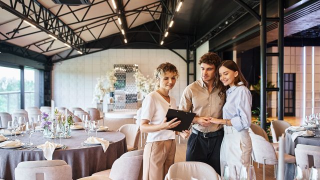 Couple Choosing a Wedding Venue with an Event Coordinator
