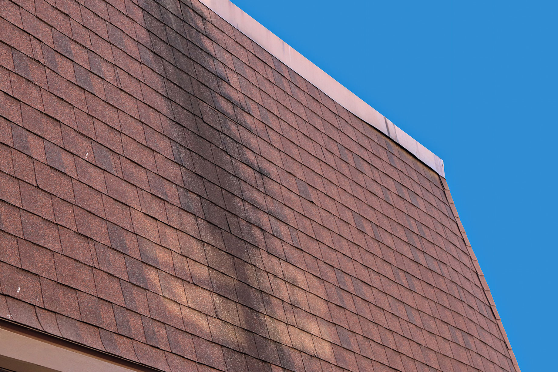 Dark Stain on Mansard Shingles