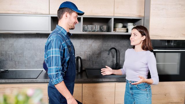 Female Homeowner with House Technician