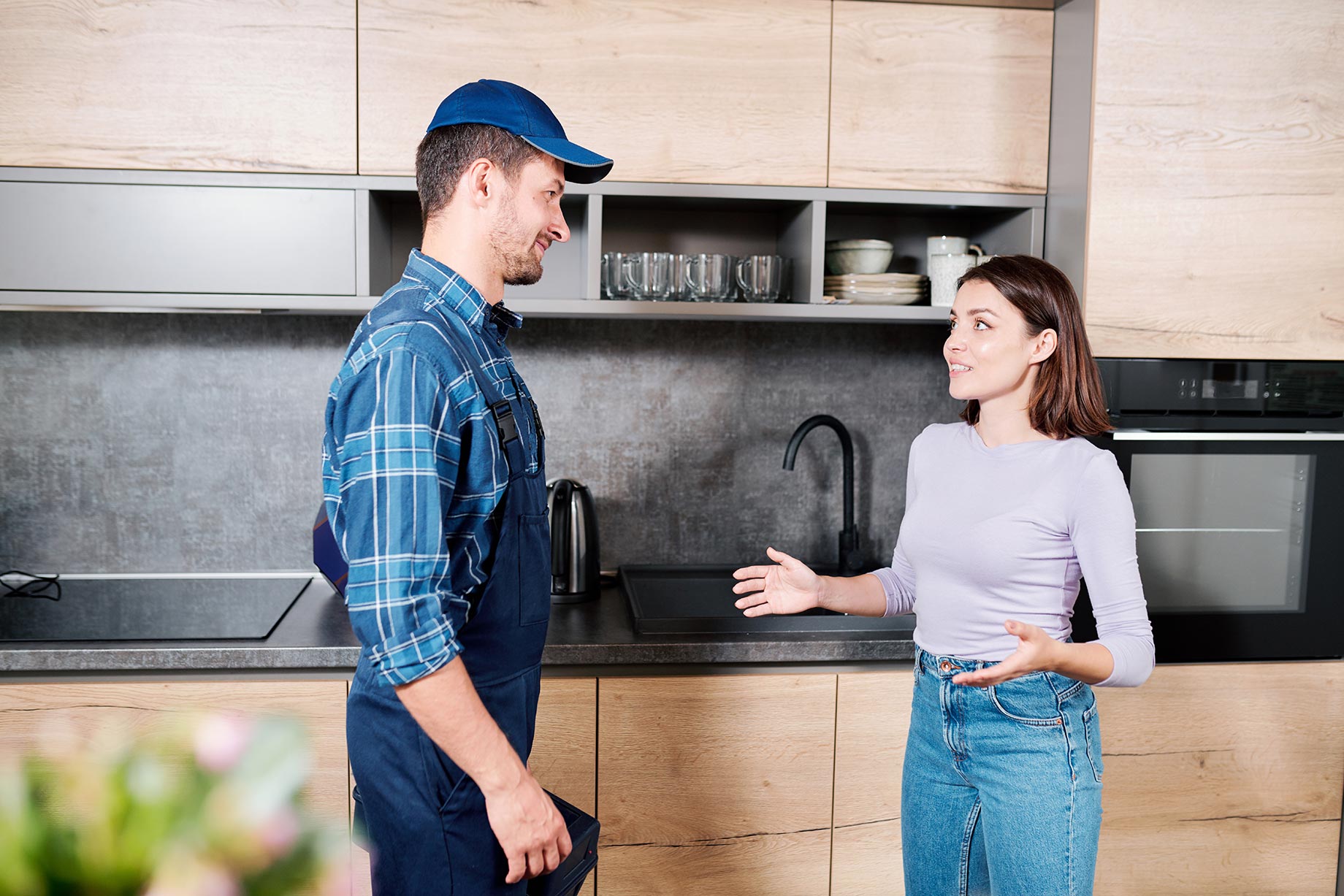 Female Homeowner with House Technician