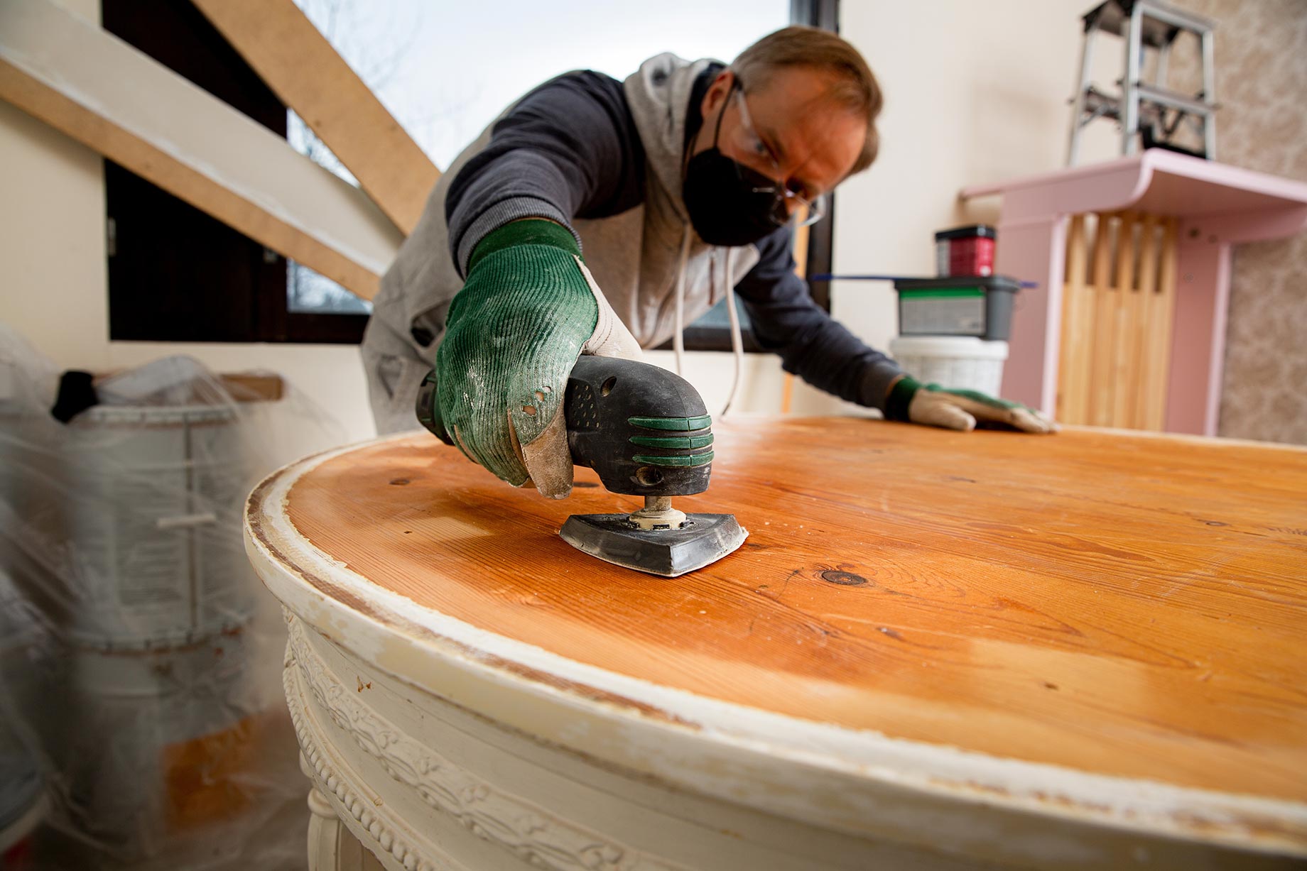 Man Restoring Old Wooden Table