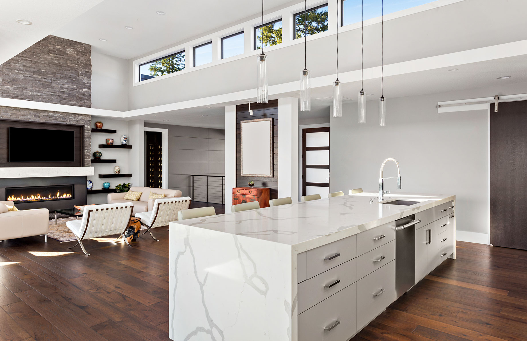 Open Concept Floor Plan with Kitchen, Living Room with Fireplace, and Ceiling Windows