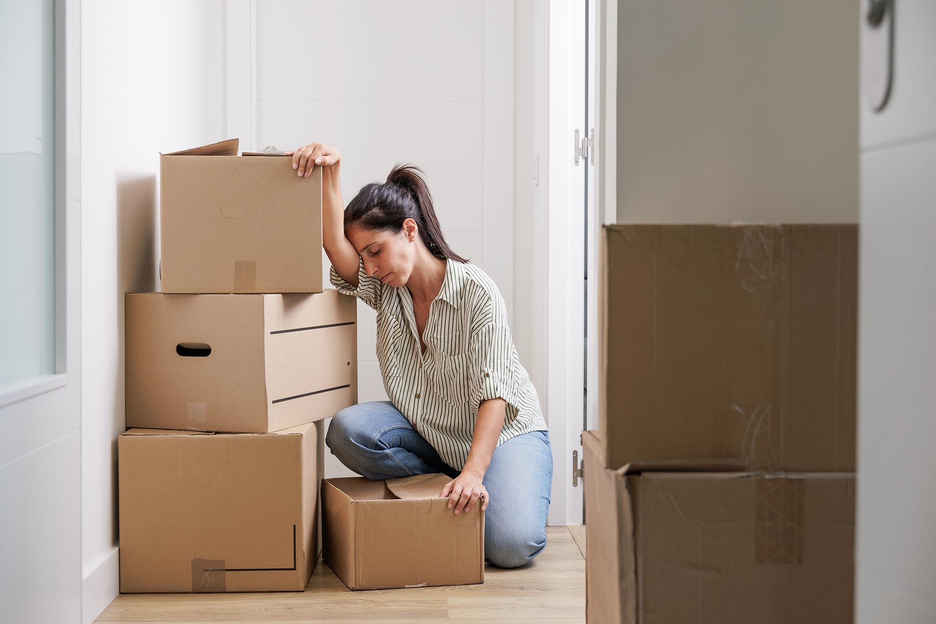 Woman Stressed with Boxes in New Home