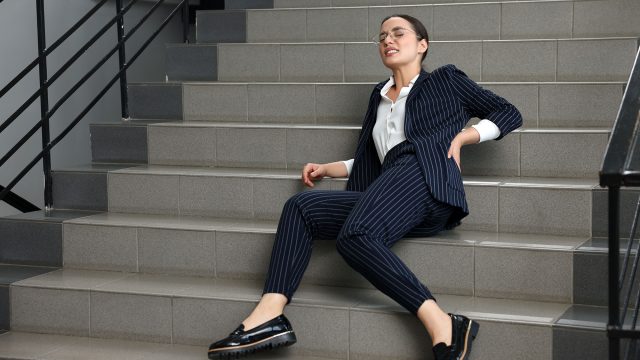 Businesswoman Falling Down Stairs